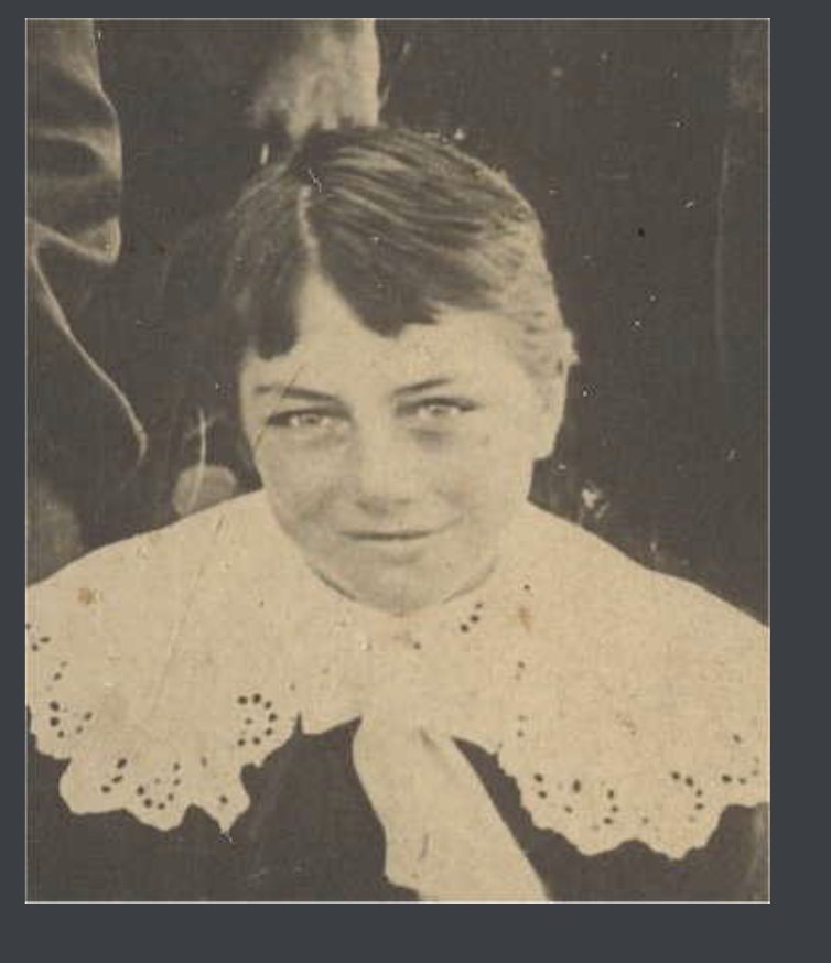 A boy in a lace collar